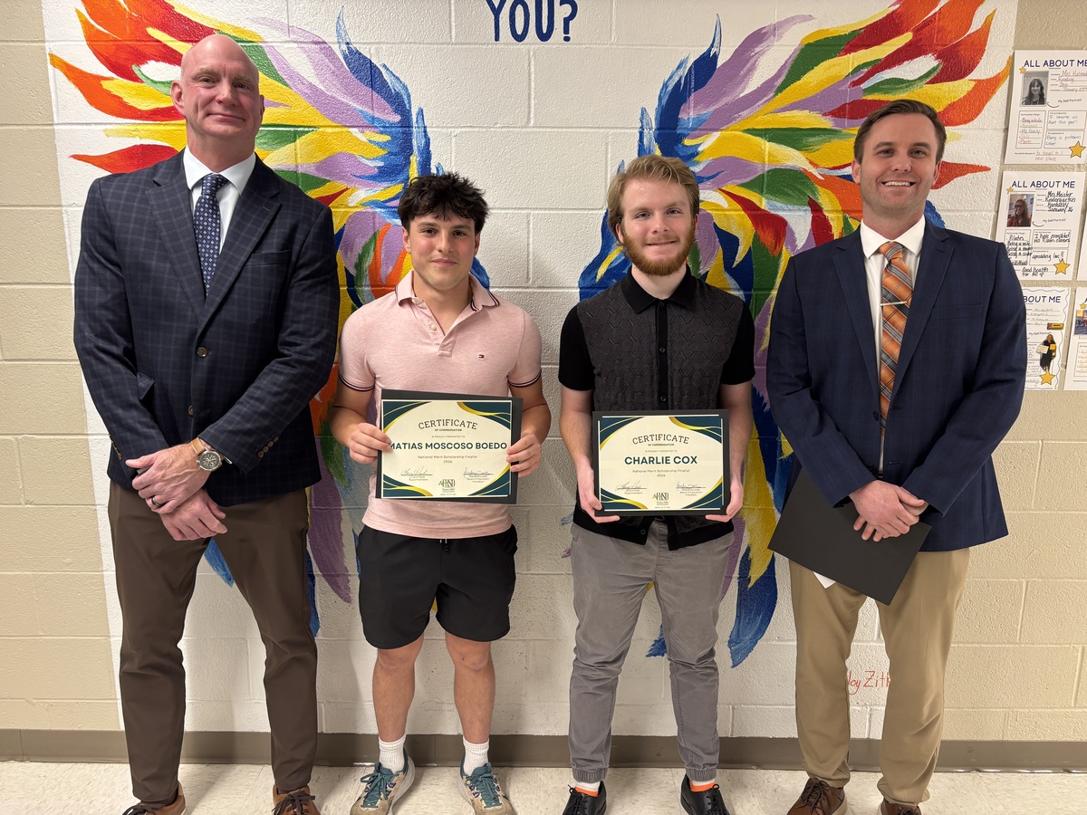 Two National Merit Scholarship Finalists pose for a photo with the AHS and THS principals.